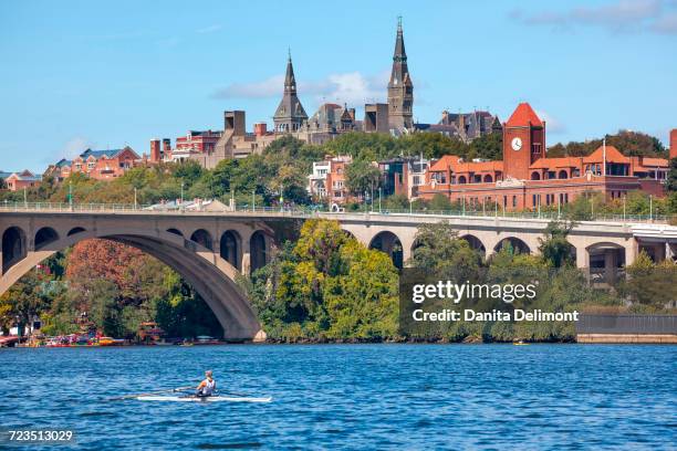 potomac river with key bridge above and georgetown university, washington dc, usa - potomac river fotografías e imágenes de stock