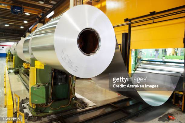 aluminium metal rolled up in factory - aluminum ストックフォトと画像