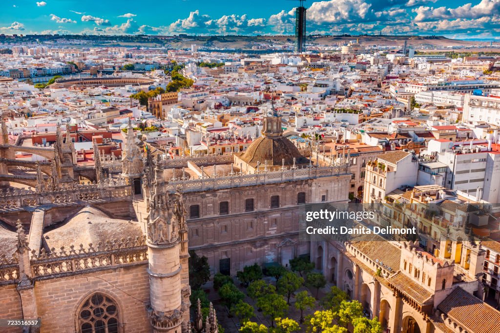 City View from Giralda Spire Bell Tower on Orange Garden and Seville Cathedral, Bull Ring in distance, Seville, Andalusia, Spain
