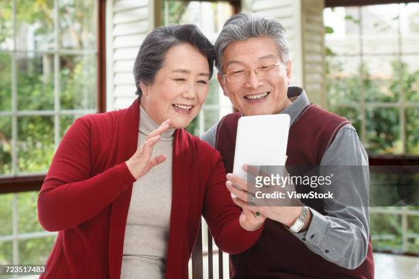 the old couple have a new year. - 65 year old asian women ストックフォトと画像