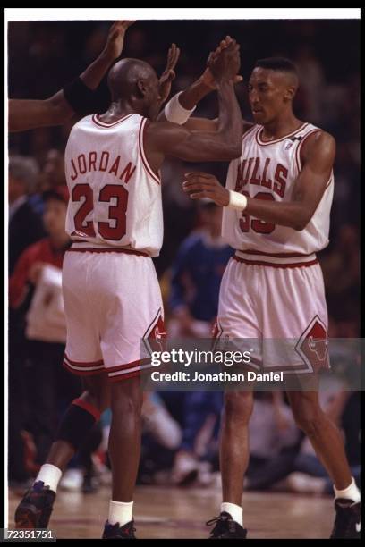 Chicago Bulls guard Michael Jordan and forward Scottie Pippen celebrate during Game Five of the Eastern Conference finals against the Cleveland...