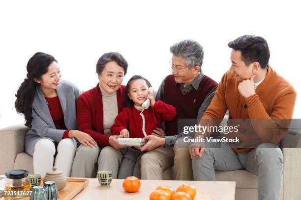 happy family phone pay new years call - 60 69 years imagens e fotografias de stock