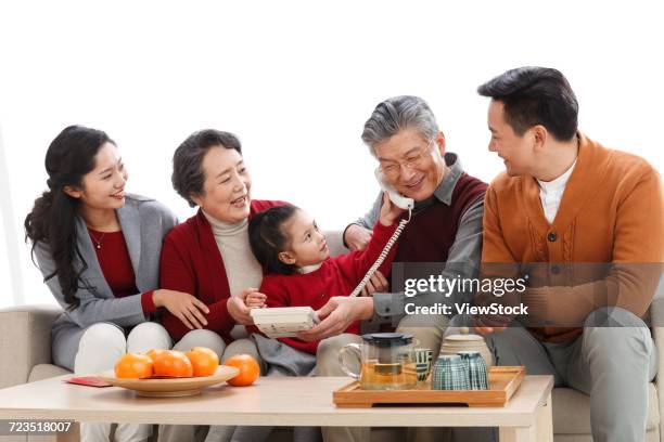happy family phone pay new years call - 60 69 years imagens e fotografias de stock