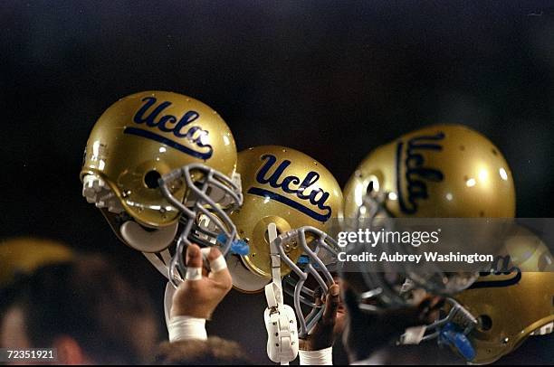 General view of helmets belonging to the UCLA Bruins held aloft during the game against the Arizona Wildcats at the Arizona Stadium in Tucson,...