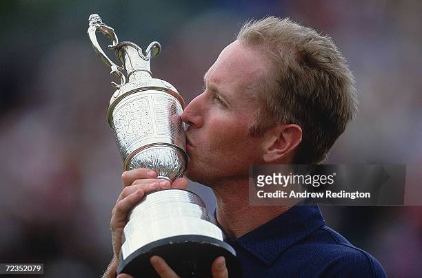 David Duval of USA kisses the claret Jug after winning the 130th British Open Championship held at the Royal Lytham and St Annes Golf Club in...
