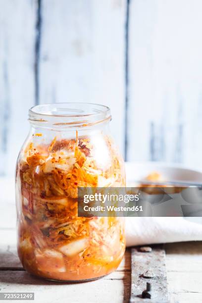 glass of homemade korean kimchi with chinese cabbage, scallions and carrots - kimchi stock pictures, royalty-free photos & images