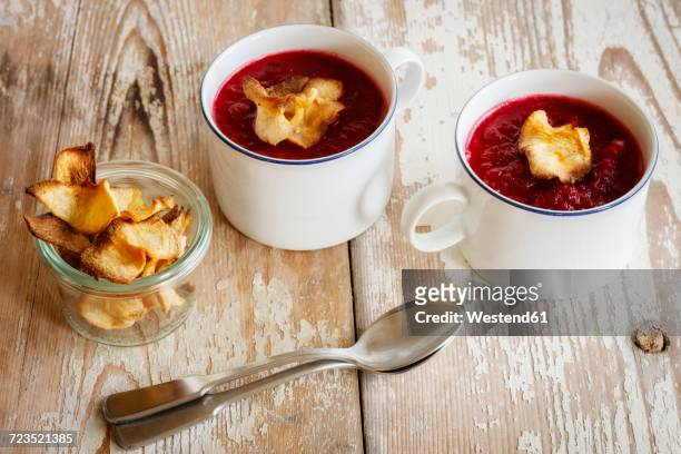 beetroot apple soup garnished with vegetable chips - vegetable chips stock pictures, royalty-free photos & images