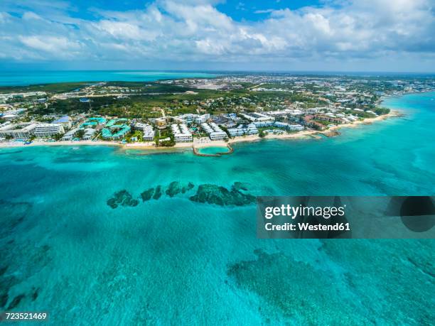 caribbean, cayman islands, george town, luxury resorts and seven mile beach - george town grand cayman stock pictures, royalty-free photos & images