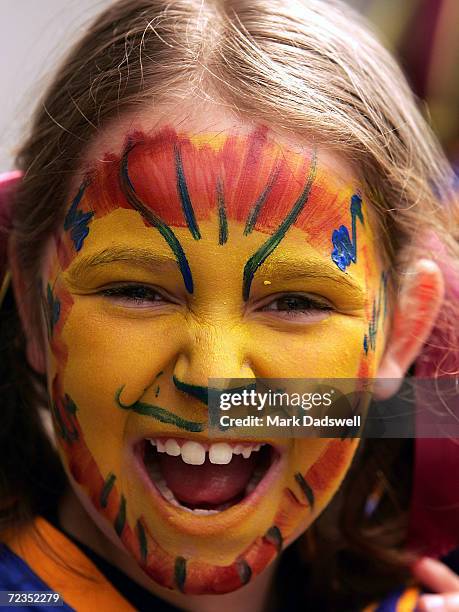 Brisbane Lions fan shows her team colors outside the Melbourne Cricket Ground prior to the AFL Grand Final between the Port Adelaide Power and...