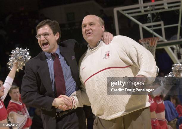 Coach Rick Majerus, right, of the University of Utah and his Assistant Coach Dick Hunsaker celebrate after defeating Saint Louis University 48-45 in...