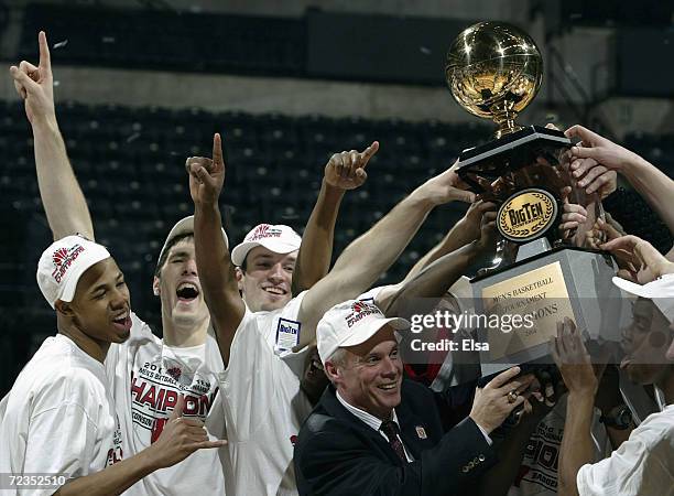 The Wisconsin Badgers and head coach Bo Ryan hoist the the Big Ten Tournament Trophy after the championship game on March 14, 2004 at the Conseco...