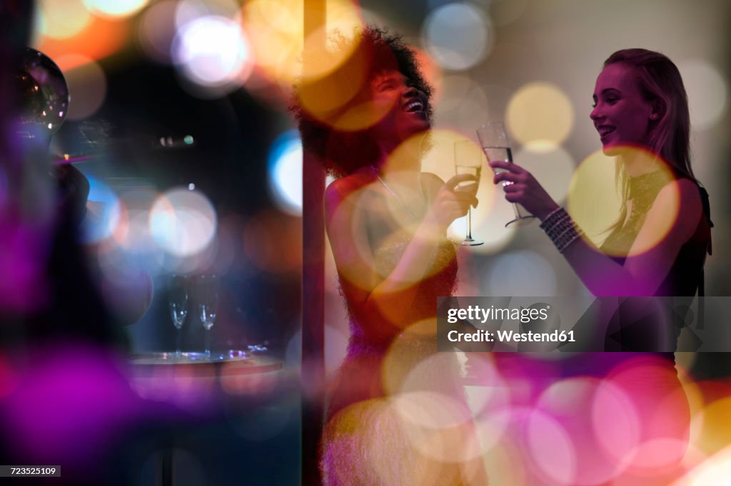 Two women having fun on a party