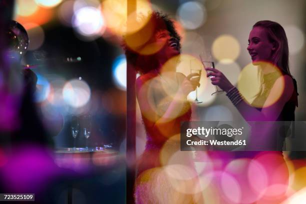 two women having fun on a party - entertainment fashion stock pictures, royalty-free photos & images