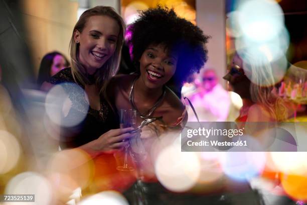 two women having fun on a party - exclusive event stock pictures, royalty-free photos & images