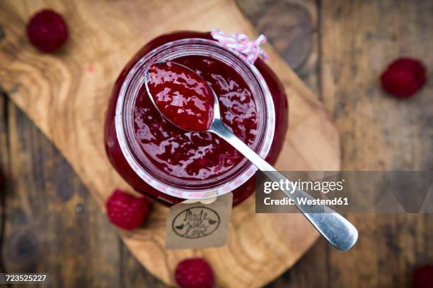 spoon of raspberry jam - raspberry jam stock pictures, royalty-free photos & images