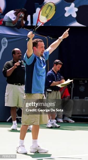 Vocalist Justin Jeffre of 98 degrees plays a charity match at the Arthur Ashe Kid's Day Family and Music Festival August 26, 2000 at the USTA...