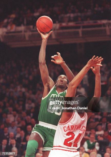 Center Robert Parish of the Boston Celtics shoots a hook shot during the Celtics versus Chicago Bulls game at Bulls Stadium in Chicago, Illinois....