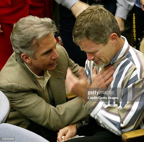 Damon van Dam , father of missing 7-year-old Danielle van Dam, is consoled by "Americas Most Wanted" host John Walsh in a San Diego Superior...