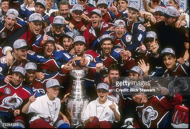 The Colorado Avalanche celebrate with the Stanley Cup after a 1-0 win in game 4 of the Stanley Cup Finals over the Florida Panthers at the Miami...