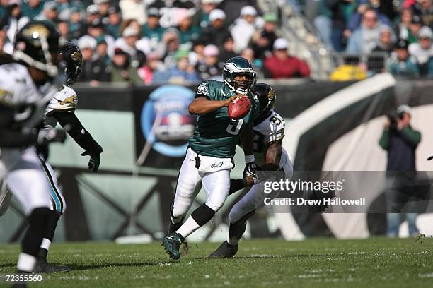 Quarterback Donovan McNabb of the Philadelphia Eagles tries to scramble away from defensive end Bobby McCray of the Jacksonville Jaguars on October...
