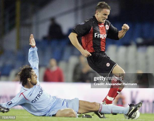 Aleksandar Vasoski of Frankfurt competes with Matias Lequi of Vigo during the UEFA Cup group H match between Celta Vigo and Eintracht Frankfurt at...