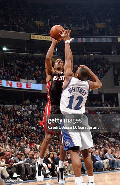 Rod Strickland of the Miami Heat shoots over Chris Whitney of the Washington Wizards during their game at MCI Center in Washington, D.C. The Heat...