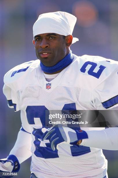 Deion Sanders of the Dallas Cowboys walks on the sidelines during the game against the Arizona Cardinals at the Sun Devil Stadium in Tempe, Arizona....