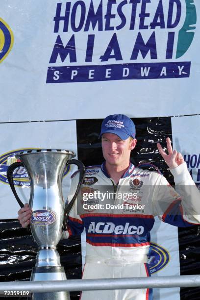 Dale Earnhardt Jr. Poses with the winning trophy after winning the Busch Series during the Hot Wheels.Com 300, part of the NASCAR Busch Series at the...