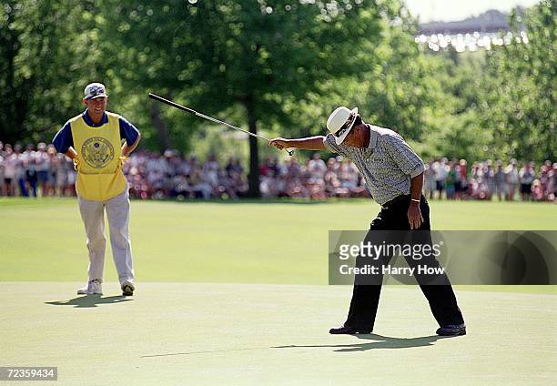 Chi Chi Rodriguez celebrates his putt during the U.S Senior Open at the Des Moines Country Club in Des Moines, Iowa. Mandatory Credit: Harry How...