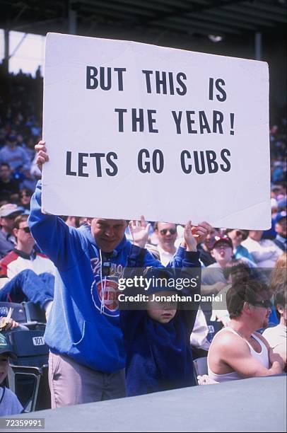 General view of fans holding a banner during a game between the San Francisco Giants and the Chicago Cubs at Wrigley Field in Chicago, Illinois. The...