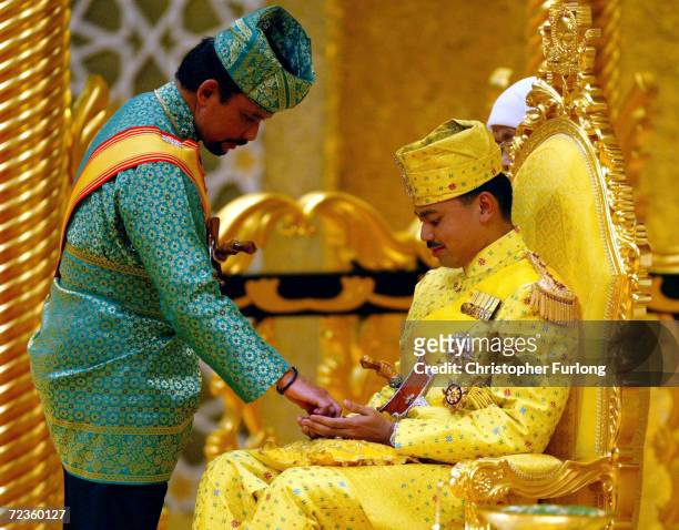 The Sultan of Brunei anoints the hands of His Royal Highness Prince Haji Al-Muhtadee Billah ibni Sultan Haji Hassanal Bolkiah Mu?izzaddin Waddaulah...