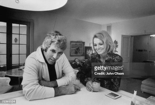 Composer Burt Bacharach Jr. And his actress wife Angie Dickinson having a drink together at their Beverly Hills home.