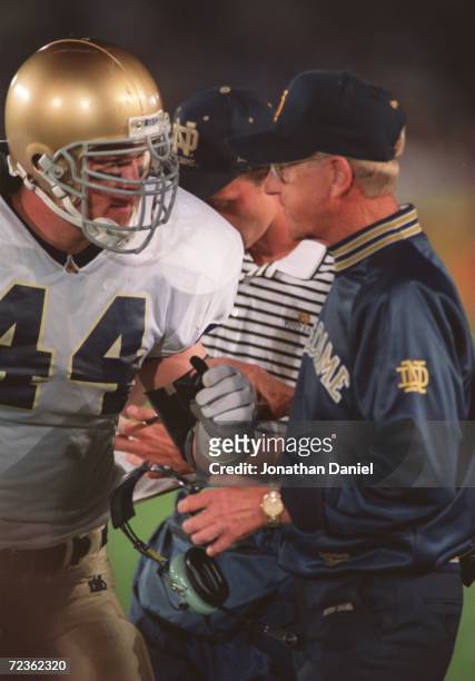 Running back Marc Edwards talks with head coach Lou Holtz of the University of Notre Dame during the Fighting Irish 42-15 win over Northwestern...