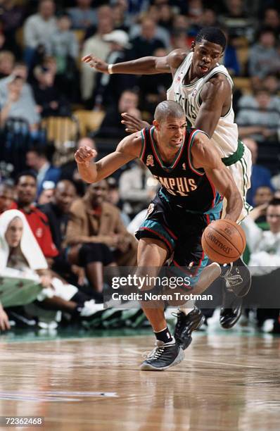 Forward Shane Battier of the Memphis Grizzlies drives past forward Joe Johnson of the Boston Celtics during the NBA game at the Fleet Center in...