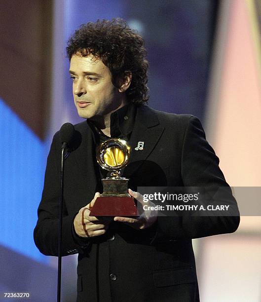 New York, UNITED STATES: Best rock song winner Gustavo Cerati accepts his award during the 7th Annual Latin Grammy Awards pre-telecast show at...