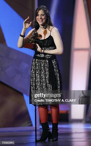 New York, UNITED STATES: Best recording package winner Laura Varsky accepts her award during the 7th Annual Latin Grammy Awards pre-telecast show at...