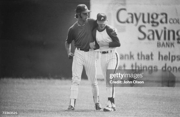 Fourteen year old Jorge Lebron , youngest player ever to be signed by major league team, listening to advice from teammate Glenn Gregson during...