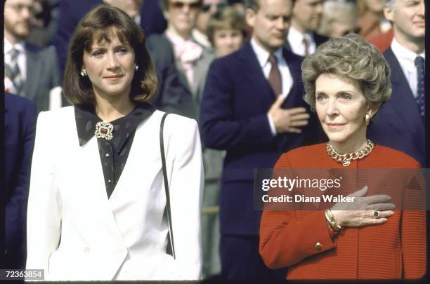 First lady Nancy Reagan with Mila Mulroney, wife of Canadian PM, during White House arrival ceremony.