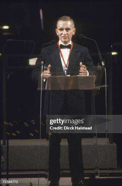 Philanthropist Ross Perot wearing Winston Churchill award medallion presented to him by Prince Charles.