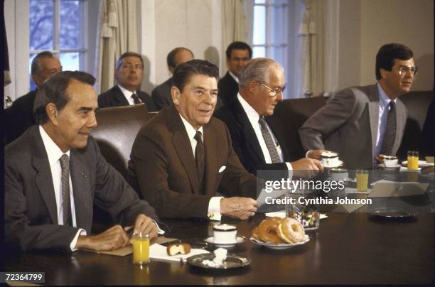 Senator Bob Dole, President Ronald Reagan, Rep. Bob Michel and rep. Trent Lott during meeting in WH cabinet room.