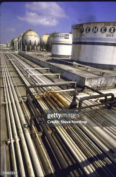 Pipelines and storage tanks at Pemex oil refinery.