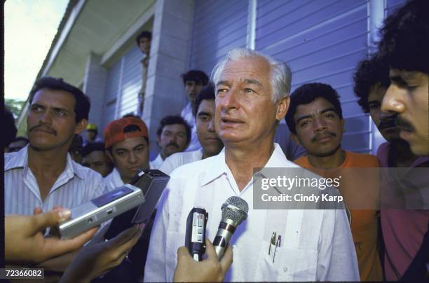 Ambassador John Ferth speaking with press.