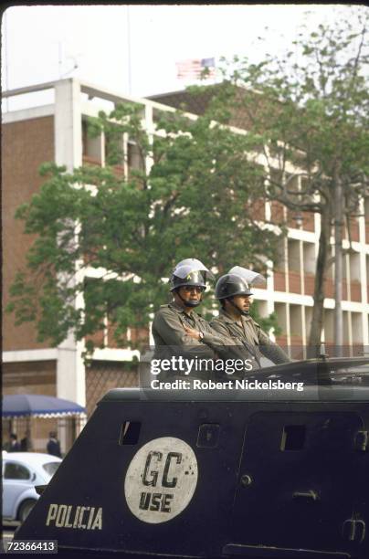 Riot police lining the street during demo against US banks imposed impaired credit status, re natl. Debt.