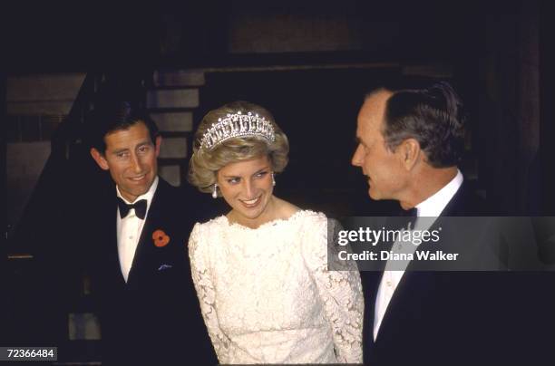 Vice President George Bush in black-tie with Prince Charles & Princess Diana at formal dinner.