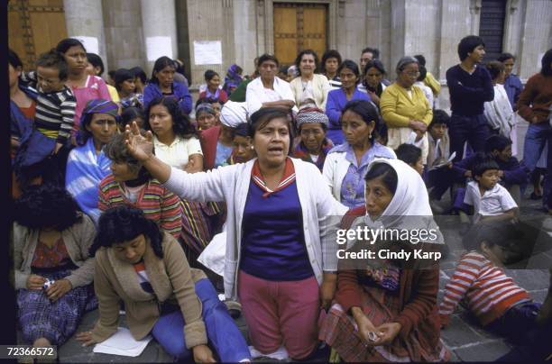 Mothers of Disappeared types hold demo, re missing relatives believed slain by right-wing mil. Government, outside Cathedral.