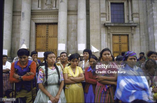 Mothers of Disappeared types hold demo, re missing relatives believed slain by right-wing mil. Government, outside Cathedral.