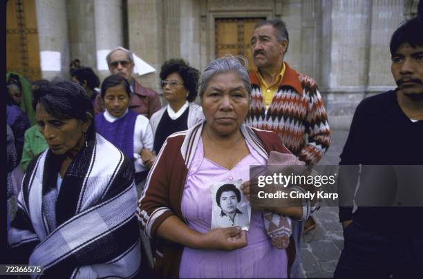 Mothers of Disappeared types hold demo, re missing relatives believed slain by right-wing mil. Government, outside Cathedral.