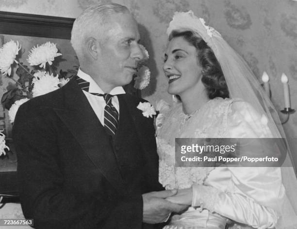 American film director and producer Howard Hawks pictured with his wife Slim Keith on their wedding day in Pasadena, California on 10th December 1941.