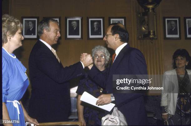 Sue Franceschini & Megly? Mihelich with Senator Alfonse D'Amato & ex-TWA 847 hostage Peter Hill, before testifying at Senatorhearing on...