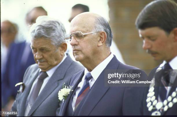 South African President P.with Botha observing moment of silence at official ceremony on Kruger Day.